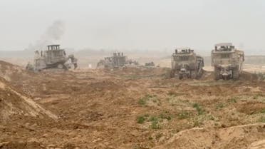 Israel Defense Forces' (IDF) armoured bulldozers are seen in a location given as Gaza, as the conflict between Israel and the Palestinian Islamist group Hamas continues, in this screengrab obtained from a handout video released on October 29, 2023. (Reuters)
