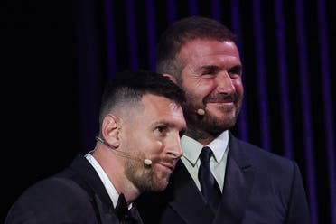 Inter Miami CF's Argentine forward Lionel Messi (L) reacts on stage as he receives his 8th Ballon d'Or award next to Former English football player and Inter Miami's co-owner David Beckham during the 2023 Ballon d'Or France Football award ceremony at the Theatre du Chatelet in Paris on October 30, 2023. (AFP)