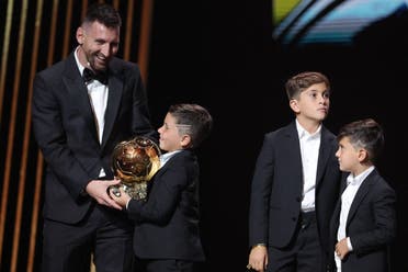 Inter Miami CF's Argentine forward Lionel Messi (L) reacts on stage with his children as he receives his 8th Ballon d'Or award during the 2023 Ballon d'Or France Football award ceremony at the Theatre du Chatelet in Paris on October 30, 2023. (AFP)