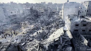 This image grab taken from AFPTV video footage shows Palestinians checking the destruction in the aftermath of an Israeli strike on the Jabalia refugee camp in the Gaza Strip, on November 1, 2023, amid ongoing battles between Israel and the Palestinian Hamas movement. (AFP)