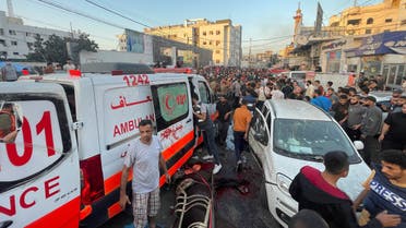 Palestinians check the damages after a convoy of ambulances was hit, at the entrance of Shifa hospital in Gaza City, November 3, 2023. (Reuters)