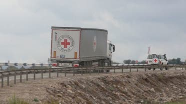 Vehicles of the International Committee of the Red Cross (ICRC) transporting humanitarian aid for residents of Nagorno-Karabakh drive towards the Armenia-Azerbaijan border along a road near the village of Kornidzor, Armenia, September 23, 2023. (File photo: Reuters)