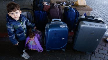 Palestinians with foreign passports wait for permission to leave Gaza, amid the ongoing conflict between Israel and Palestinian Islamist group Hamas, at the Rafah border crossing with Egypt, in Rafah in the southern Gaza Strip, November 7, 2023. REUTERS/Ibraheem Abu Mustafa
