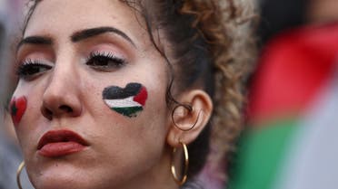 A protester wears a painted Palestinian flag on her cheek during a 'March For Palestine' in London on October 28, 2023, to call for a ceasefire in the conflict between Israel and Hamas. (File photo: AFP)