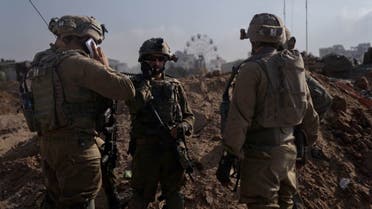 Israeli soldiers stand at a position amid the ongoing ground operation of the Israeli army against the Palestinian group Hamas, in the Gaza Strip, in this handout image released by the Israel Defense Forces on November 8, 2023. (Reuters)