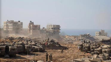 Israeli soldiers and tanks take position inside the Gaza Strip, according to the Israeli Defense Forces (IDF), in this handout picture obtained by Reuters on November 5, 2023. (Reuters)