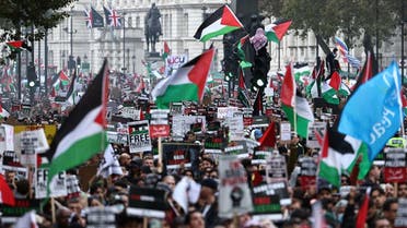 People take part in a “March For Palestine,” in London on October 21, 2023, to “demand an end to the war on Gaza.” (AFP)