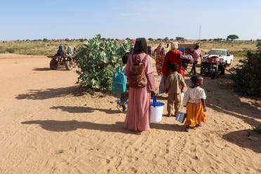 Women look at the border, hoping that their relatives reach Chad to escape death as they wait for them in Chad, November 7, 2023. (Reuters)