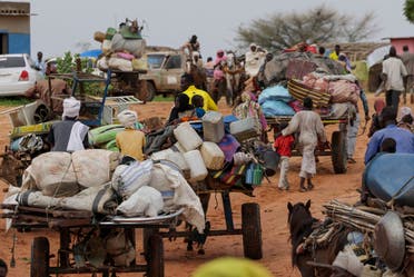 Chadian cart owners transport belongings of Sudanese people who fled the conflict in Sudan’s Darfur region, while crossing the border between Sudan and Chad in Adre, Chad August 4, 2023. (Reuters)