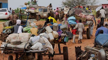 Chadian cart owners transport belongings of Sudanese people who fled the conflict in Sudan's Darfur region, while crossing the border between Sudan and Chad in Adre, Chad August 4, 2023. (Reuters)