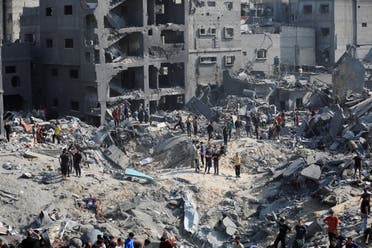 Palestinians search for casualties a day after Israeli strikes on houses in Jabalia refugee camp in the northern Gaza Strip, November 1, 2023. (Reuters)