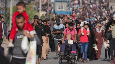 Palestinians flee to the southern Gaza Strip on Salah al-Din Street in Bureij, Gaza Strip, on Wednesday, November 8, 2023. (AP)