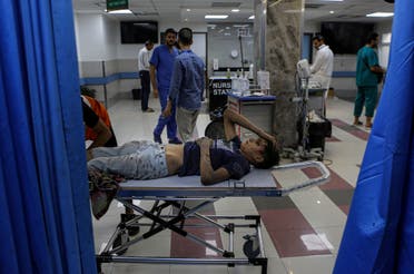 A wounded Palestinian boy arrives to the emergency room of the al-Shifa hospital, following Israeli airstrikes on Gaza City, central Gaza Strip, Tuesday, Oct. 17, 2023. (AP)