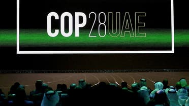 'Cop28 UAE' logo is displayed on the screen during the opening ceremony of Abu Dhabi Sustainability Week (ADSW) under the theme of 'United on Climate Action Toward COP28', in Abu Dhabi, UAE, January 16, 2023. (File photo, Reuters)
