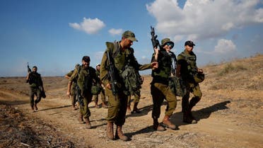 Israeli soldiers patrol an area on the Israeli side of the Israel-Gaza border amid the ongoing conflict between Israel and the Palestinian group Hamas, November 15, 2023. (Reuters)