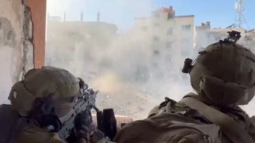 Israeli soldiers fire during the ongoing ground operation of the Israeli army against Palestinian Islamist group Hamas, in a location given as Gaza, in this screen grab from a handout video released on November 13, 2023. (File photo: Reuters)