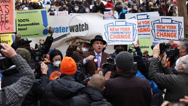 Eric Weltman, a senior organizer with Food & Water Action, delivers remarks as climate advocates rally at City Hall Park to celebrate the passage of a bill to end gas use in new buildings in Manhattan, New York City, U.S., December 15, 2021. REUTERS/Andrew Kelly