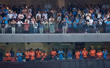 India players, coaching staff and people seated above them applaud after India’s Virat Kohli returned to the pavilion after losing his wicket, caught out by New Zealand’s Devon Conway off the bowling of Tim Southee during the ICC Cricket World Cup 2023 semi-final - against New Zealand, at the Wankhede Stadium, Mumbai, India, on November 15, 2023. (Reuters) 