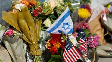 Flowers and flags are placed at the exact location on the sidewalk of the alleged assault on Paul Kessler on Sunday in Thousand Oaks, California, U.S., November 7, 2023. (Reuters)