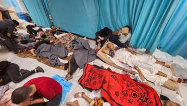 Palestinians wounded in Israeli strikes lie on the floor as they are assisted at the Indonesian hospital after Al-Shifa Hospital has gone out of service amid Israeli ground offensive, in the northern Gaza Strip on November 16, 2023. (Reuters)