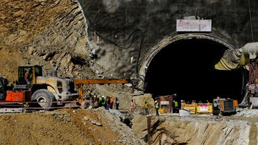 Heavy machinery moves outside a tunnel where 40 road workers are trapped after a portion of the tunnel collapsed in Uttarkashi in the northern state of Uttarakhand, India, November 16, 2023. (Reuters)