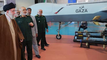 This handout picture provided by the office of Iran’s Supreme Leader Ali Khamenei shows him (L), and Hossein Salami, head of Iran’s Islamic Revolutionary Guard Corps (IRGC) (2nd-L) during a visit at the IRGC aerospace achievement exhibition in Tehran on November 19, 2023. (AFP)