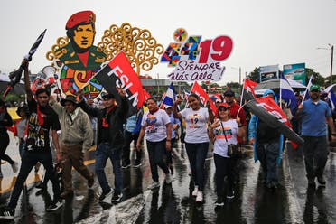 Supporters of Nicaraguan President Daniel Ortega take part in a march on the eve of the 44th anniversary of the Nicaraguan Revolution in Managua, on July 17, 2023. (AFP)