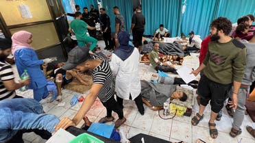 Palestinians wounded in Israeli strikes lie on the ground as they are assisted at the Indonesian hospital after Al Shifa hospital has gone out of service amid Israeli ground offensive, in the northern Gaza Strip November 16, 2023. (Reuters)