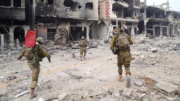 Israeli troops operate in the Gaza Strip, amid the ongoing ground operation of the Israeli army against the Palestinian group Hamas, in this handout image released November 19, 2023. (Israeli military via Reuters)
