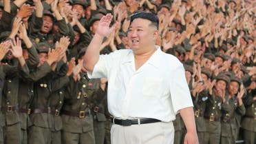 North Korean leader Kim Jong Un waves next to participants of the civil defense military parade commemorating the 75th anniversary of the founding of the country, in this picture released on September 11, 2023. KCNA via REUTERS ATTENTION EDITORS - THIS IMAGE WAS PROVIDED BY A THIRD PARTY. REUTERS IS UNABLE TO INDEPENDENTLY VERIFY THIS IMAGE. NO THIRD PARTY SALES. SOUTH KOREA OUT. NO COMMERCIAL OR EDITORIAL SALES IN SOUTH KOREA.
