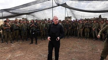 Israel's Defence Minister Yoav Gallant meets soldiers in a field near Israel's border with the Gaza Strip, in southern Israel October 19, 2023. (Reuters)