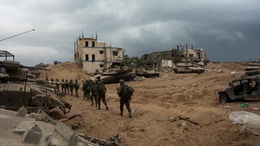 Israeli soldiers operate in the Gaza Strip, amid the ongoing ground operation of the Israeli army against the Palestinian group Hamas, in this handout image released November 20, 2023. (Reuters)