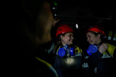 Nataliia, 43-years-old and Krystyna, 22-years-old, go down in an elevator to their underground workplace, amid Russia's attack on Ukraine, at a mine in Dnipropetrovsk region, Ukraine November 17, 2023. (Reuters)