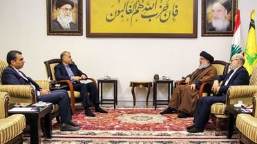 This handout picture provided by Hezbollah’s media office on November 23, 2023, shows the Lebanese Shia group’s leader Hassan Nasrallah meeting with Iran’s Foreign Minister Hossein Amir-Abdollahian, at an undisclosed location in Lebanon. (AFP)