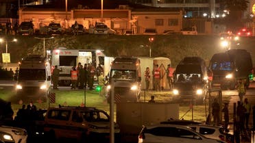 Israeli security forces stand next to ambulances waiting outside the helipad of Tel Aviv's Schneider medical centre on November 24, 2023, amid preparations for the release of Israeli hostages held by Hamas in Gaza in exchange for Palestinian prisoners later in the day. (AFP)