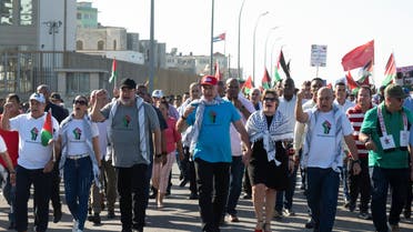 Cuban President Miguel Diaz-Canel, joined by other Cuban leaders, passes by in front of the U.S. Embassy during a march in support of Palestinians in Gaza, in Havana, Cuba, November 23, 2023. (Reuters)