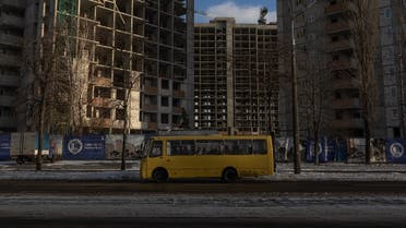 A bus drives past unfinished residential apartment buildings in Kyiv, on November 27, 2023, amid the Russian invasion of Ukraine. (AFP)