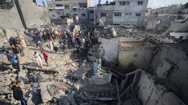 Palestinians check the damage of houses destroyed in an Israeli strike on Khan Yunis in the southern Gaza Strip on December 1, 2023, after the expiration of a seven-day truce between Israel and Hamas militants. A temporary truce between Israel and Hamas expired on December 1, with the Israeli army saying combat operations had resumed, accusing Hamas of violating the operational pause. (AFP)