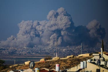 This picture taken from southern Israel near the border with the Gaza Strip shows smoke rising from buildings still after being hit by Israeli strikes, on December 1, 2023. (AFP)