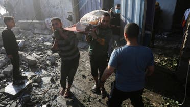 Palestinians evacuate wounded in Israeli bombardment Rafah, Gaza Strip, Friday, Dec. 1, 2023. (AP Photo/Hatem Ali)