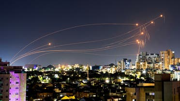 Israel's Iron Dome anti-missile system intercepts rockets launched from the Gaza Strip, after a temporary truce between Israel and the Palestinian Islamist group Hamas expired, as) seen from Ashkelon, Israel, December 1, 2023. (Reuters