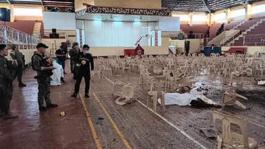 Law enforcement officers investigate the scene of an explosion that occurred during a Catholic Mass in a gymnasium at Mindanao State University in Marawi, Philippines, December 3, 2023. (Lanao Del Sur Provincial Government/Handout via Reuters)