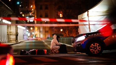 A forensic police officer works at the scene of a stabbing in Paris on December 2, 2023. (AFP)
