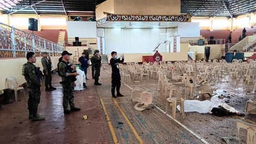 This handout photo taken on December 3, 2023 and released via the Lanao Del Sur Provincial Information Office's Facebook page shows police and the provincial governor Mamintal Adiong Jr. (back C with cap) inspecting the site of a bomb attack inside a gymnasium at Mindanao State University in Marawi. At least four people died and dozens were wounded on December 3 in a bomb attack on a Catholic mass in the insurgency-plagued southern Philippines. (AFP)