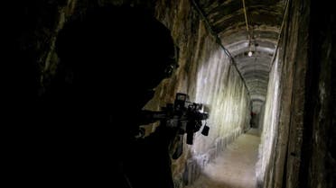 An Israeli soldier secures a tunnel underneath Al Shifa Hospital in Gaza City, amid the ongoing ground operation of the Israeli army against Palestinian militia group Hamas, in the northern Gaza Strip, November 22, 2023. (Reuters)