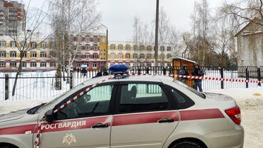 Law enforcement officers stand guard outside Gymnasium Number Five following a shooting, in Bryansk on December 7, 2023. (AFP)