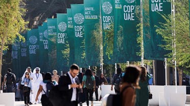 Delegates walk at the United Nations Climate Change Conference COP28 in Dubai, United Arab Emirates, December 8, 2023. (Reuters)
