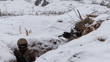 Ukrainian soldiers train in a trench during Combined Arms Training in Wedrzyn, Poland, December 7, 2023. (Reuters)