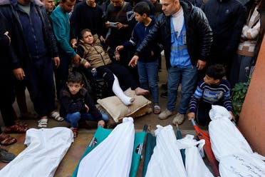 A Palestinian boy, who was injured in an Israeli raid reacts, as he attends the funeral of family members who were killed in the raid, amid the ongoing conflict between Israel and the Palestinian group Hamas, at Nasser hospital in Khan Younis, in the southern Gaza Strip, December 10, 2023. (Reuters)