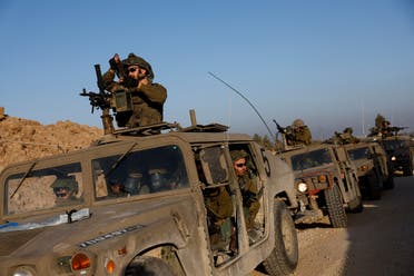 Israeli soldiers prepare to enter Gaza, amid the ongoing conflict between Israel and the Palestinian group Hamas, on the Israeli side of the Israel-Gaza border, December 11, 2023. (Reuters)